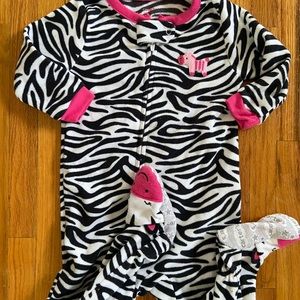 Carter’s fleece footed zip up girls pajamas.